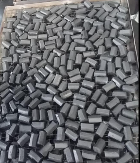 Sawdust charcoal briquettes undergoing the drying process before final packing.
