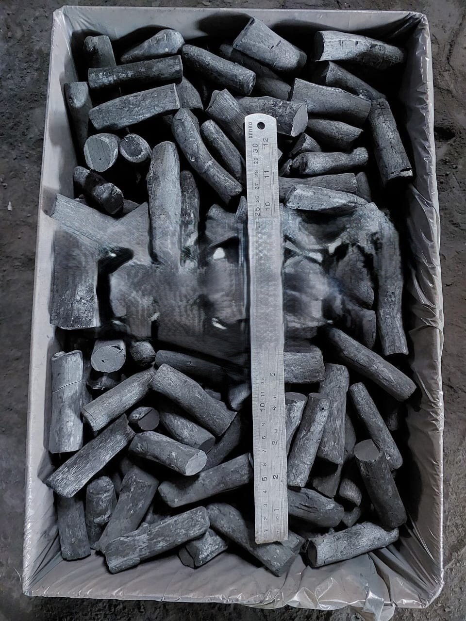 Hardwood charcoal packed in a box, prepared for storage and export distribution.