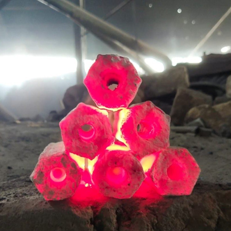 Sawdust charcoal briquette burning test showing heat stability and combustion performance.